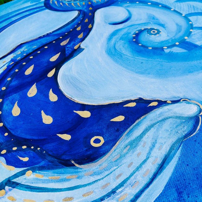 A close up image of a blue whale painting 