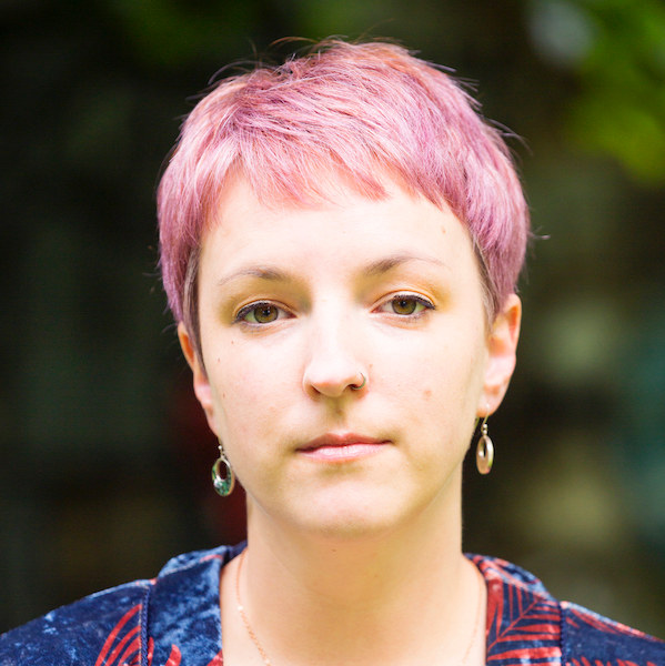 Portrait of Lauren McLaughlin, an appearing white woman, with short pink hair