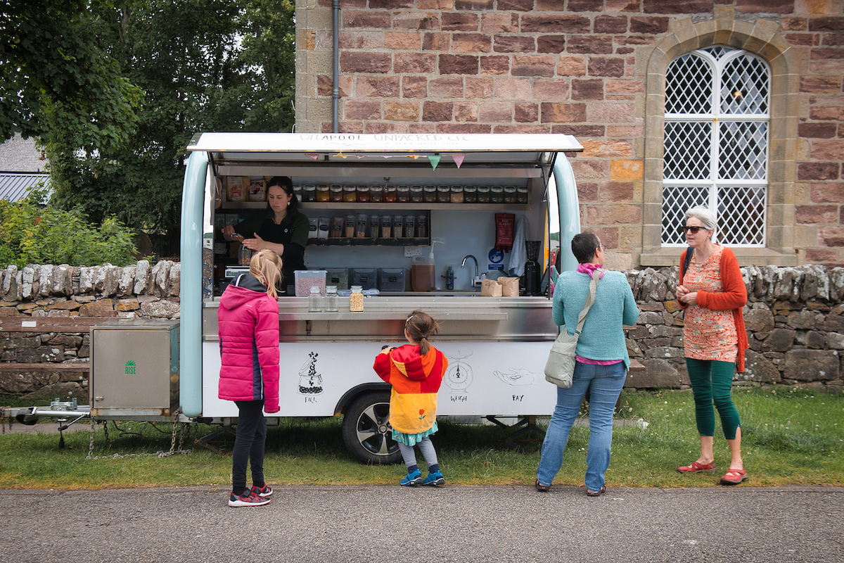 Customers queuing for produce at the Ullapool Unpacked C.I.C. van