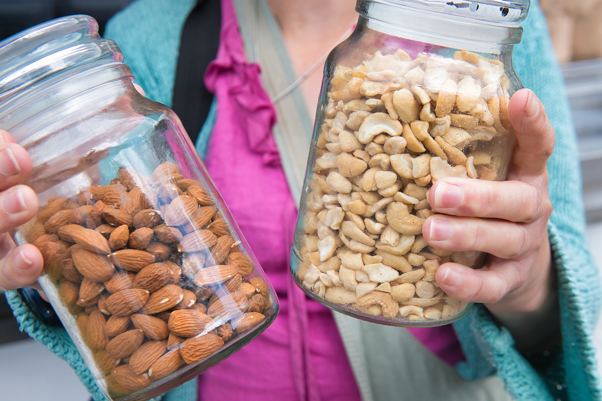 A customer with their refilled jars