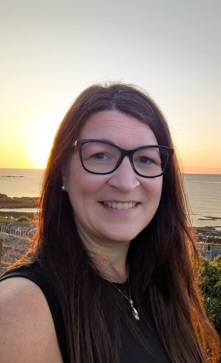 Image of Christine smiling at the camera