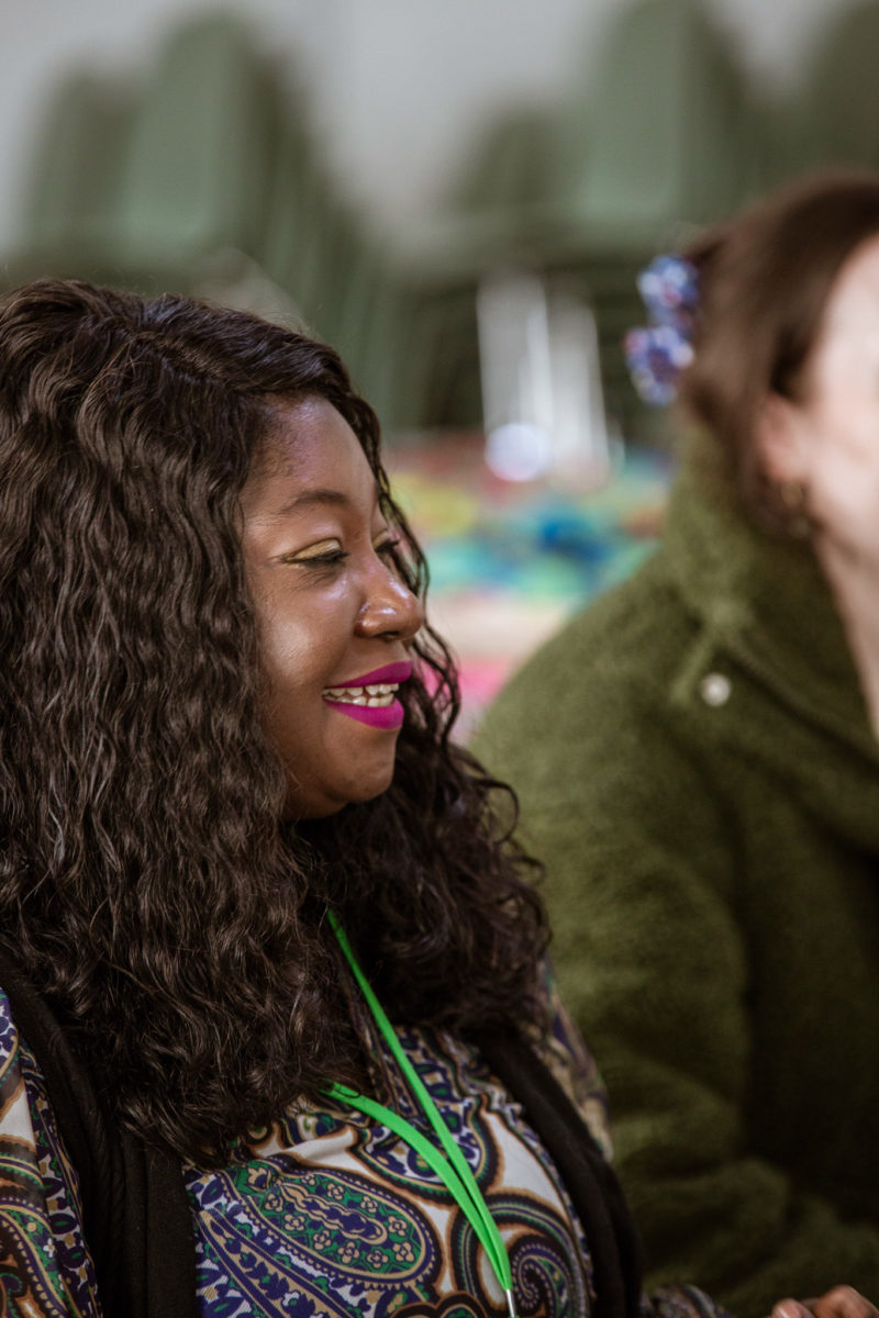 Image of people smiling and listening at recent LaunchMe event