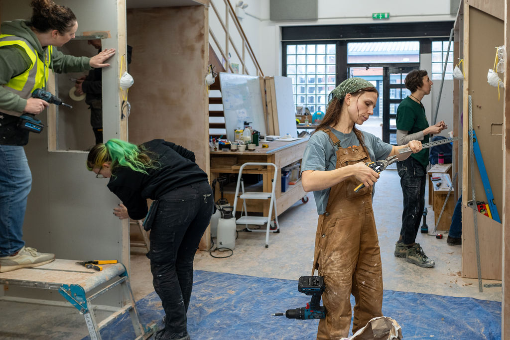 Image of people painting and decorating with Glasgow Trades Collective