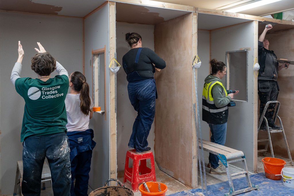 Image of people painting and decorating with Glasgow Trades Collective