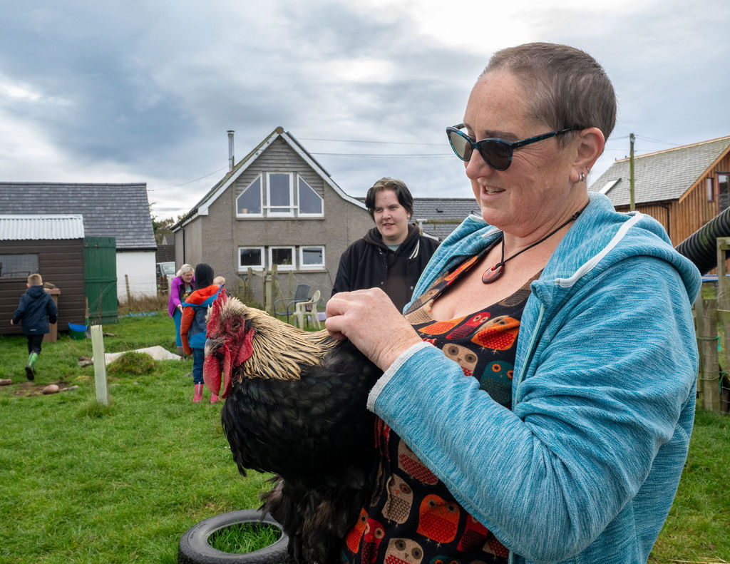 Image of person holding a chicken at The Paddock Broom of Moy