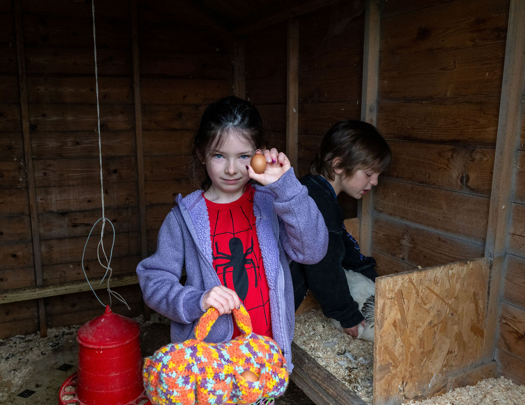 Image of young person holding fresh eggs at The Paddock Broom of Moy CIC