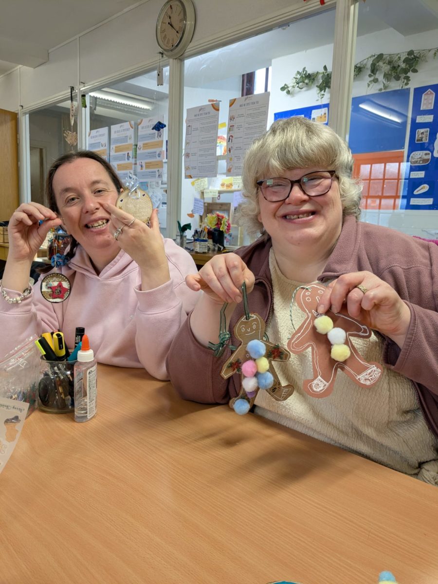 Images of two people crafting at Uppertunity smiling and looking at the camera