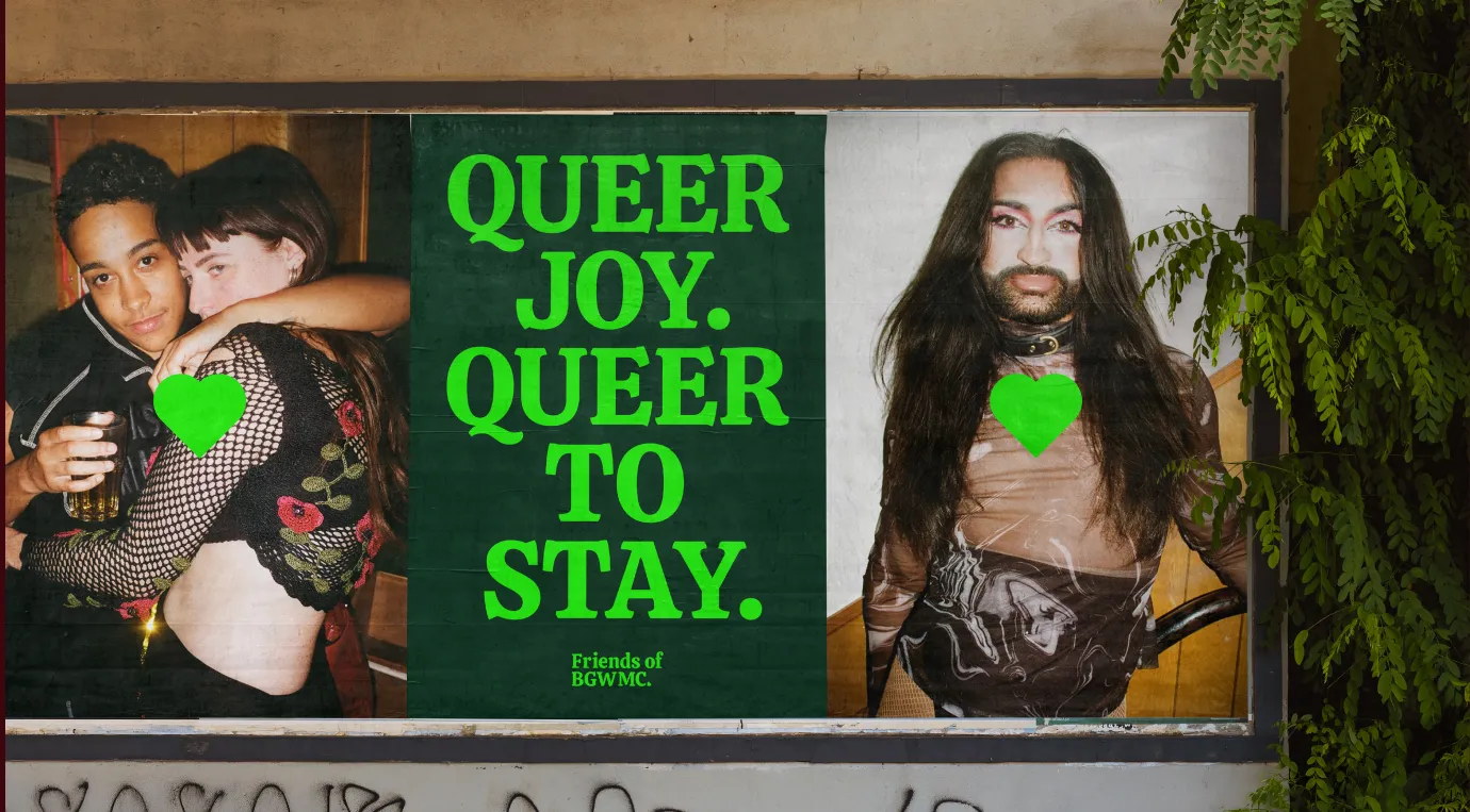 Poster with two portraits on either side of bold green text reading “QUEER JOY. QUEER TO STAY.” and “Friends of BGWMC,” with green heart graphics overlaid.